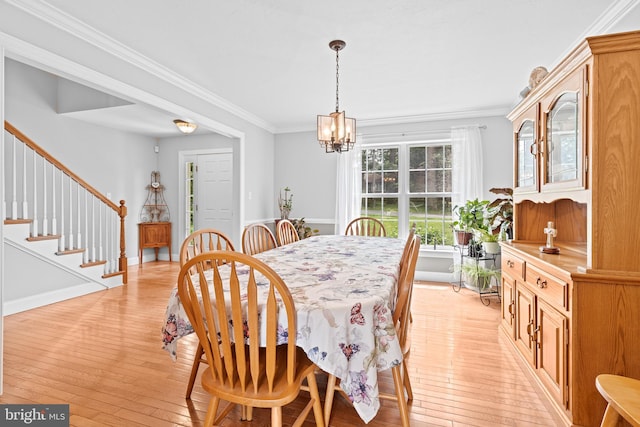 501 Bald Eagle Ct, Lancaster, PA 17601 - dining space with a chandelier, light wood-style floors, ornamental molding, and stairs