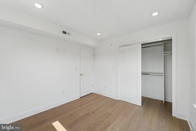 919 S 11th St Unit A, Philadelphia, PA 19147 - unfurnished bedroom with wood finished floors, a closet, and recessed lighting
