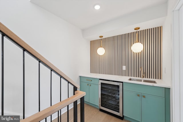 919 S 11th St Unit A, Philadelphia, PA 19147 - indoor bar with wine cooler, light wood finished floors, pendant lighting, and recessed lighting