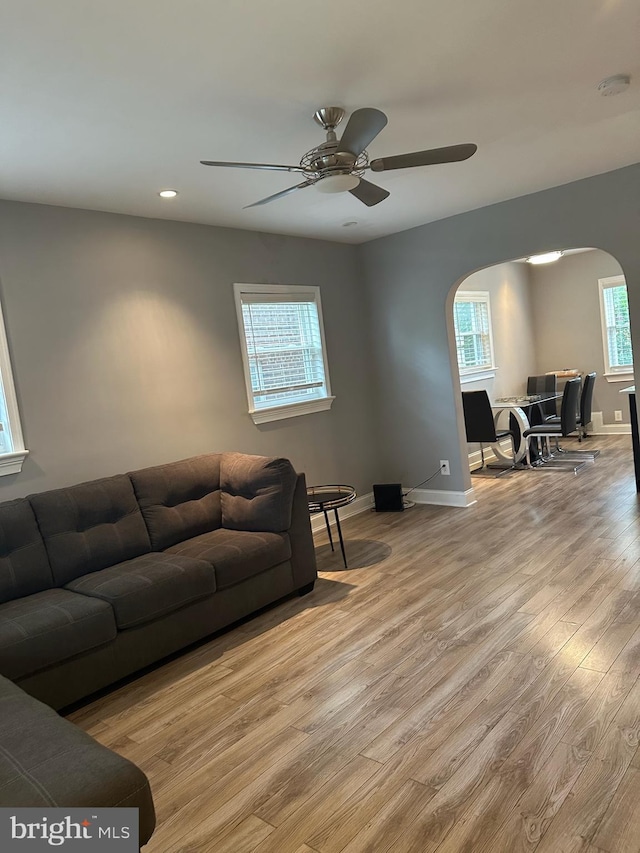 4627 12th St NE, Washington, DC 20017 - living room with arched walkways, wood finished floors, a ceiling fan, and recessed lighting