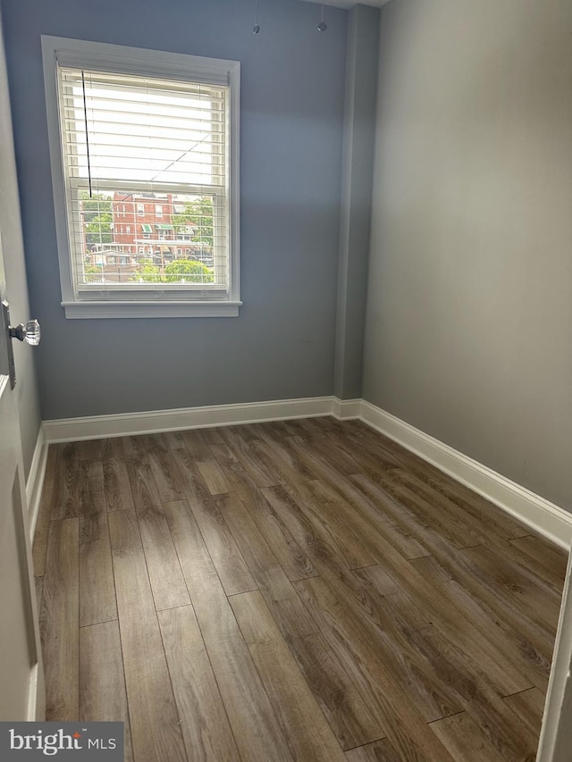 4627 12th St NE, Washington, DC 20017 - empty room featuring dark wood finished floors and baseboards