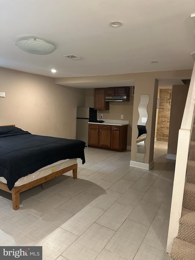 4627 12th St NE, Washington, DC 20017 - bedroom featuring freestanding refrigerator and recessed lighting
