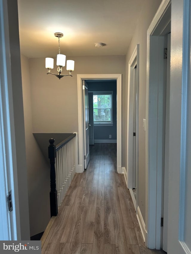 4627 12th St NE, Washington, DC 20017 - hall featuring wood finished floors and a chandelier