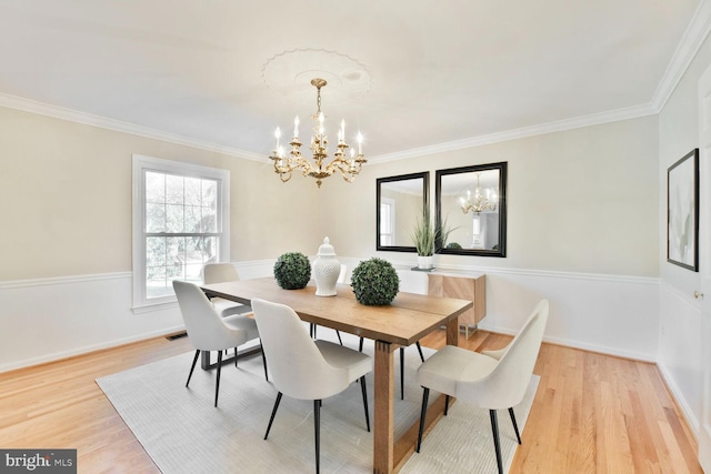 1517 Tuba Ct, Vienna, VA 22182 - dining area with a chandelier, light wood-style flooring, and crown molding