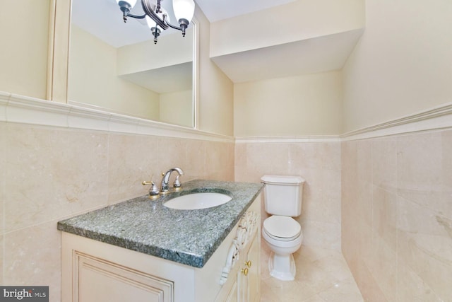 1517 Tuba Ct, Vienna, VA 22182 - bathroom with tile walls, vanity, tile patterned flooring, and wainscoting
