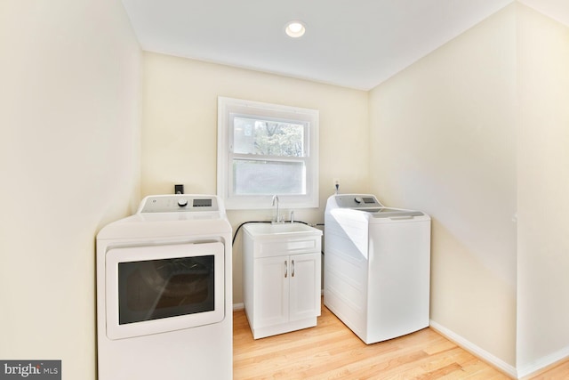 1517 Tuba Ct, Vienna, VA 22182 - laundry room with washing machine and dryer, light wood-type flooring, cabinet space, and recessed lighting