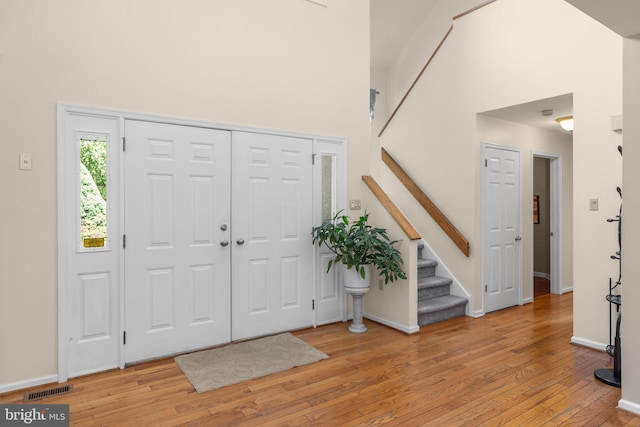 24 Rosette Ln, Richboro, PA 18954 - foyer entrance featuring light wood-type flooring, stairs, and a towering ceiling