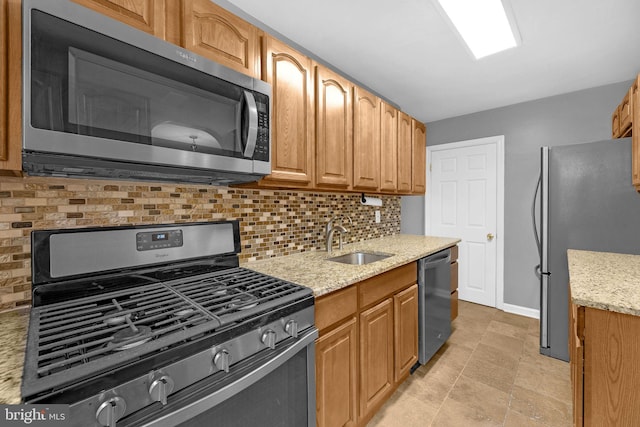2864 Cushing Rd, Camden, NJ 08104 - kitchen with stainless steel appliances, decorative backsplash, and light stone counters