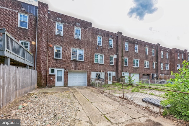 2864 Cushing Rd, Camden, NJ 08104 - view of building exterior with an attached garage and concrete driveway