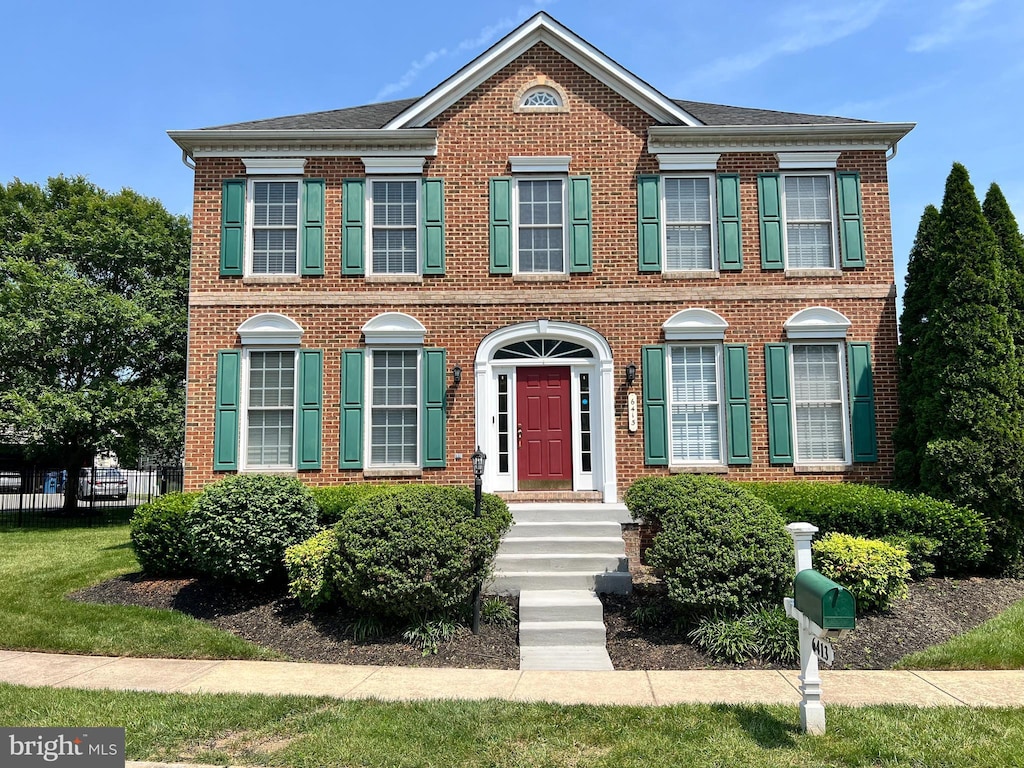 6413 Morven Park Ln, Gainesville, VA 20155 - georgian-style home featuring brick siding
