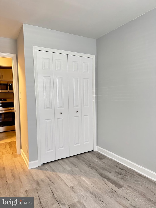 202 Grosvenor Lane 72 ( Apt. 3), Stafford, VA 22556 - unfurnished bedroom with light wood-type flooring and a closet