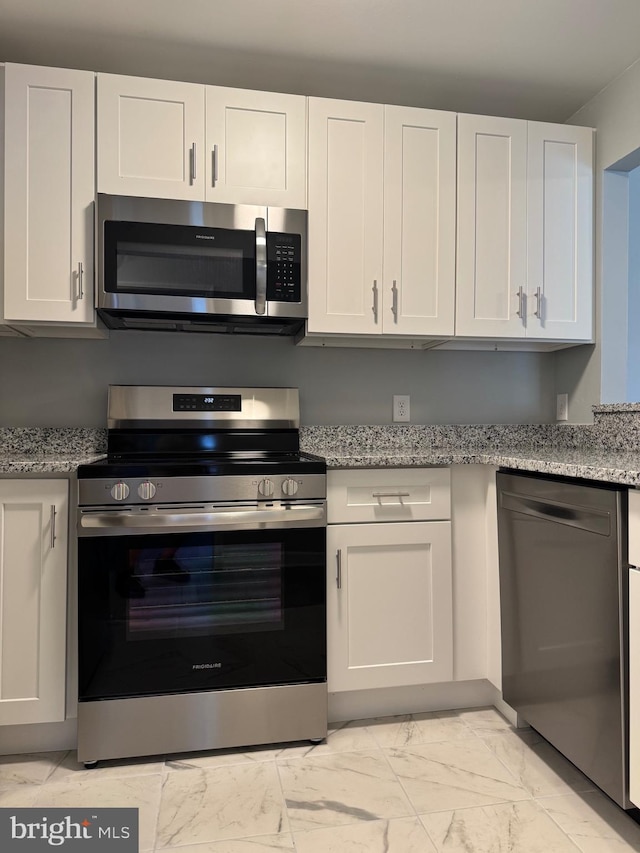 202 Grosvenor Lane 72 ( Apt. 3), Stafford, VA 22556 - kitchen featuring stainless steel appliances, light marble finish floors, white cabinets, and light stone counters