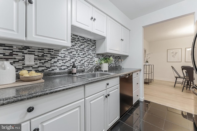 3460 Summit Ct NE Unit 3460, Washington, DC 20018 - kitchen featuring stainless steel dishwasher, white cabinets, dark countertops, and decorative backsplash