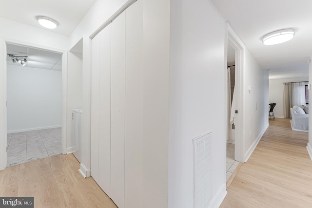 3460 Summit Ct NE Unit 3460, Washington, DC 20018 - hall with light wood-style flooring and baseboards