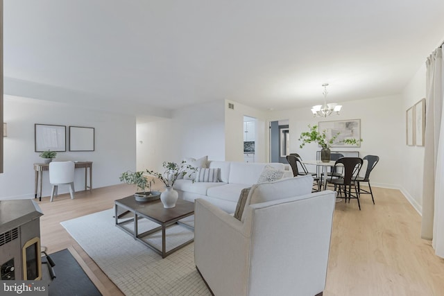 3460 Summit Ct NE Unit 3460, Washington, DC 20018 - living room with a chandelier and light wood-style flooring