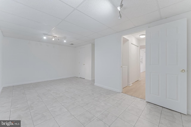 3460 Summit Ct NE Unit 3460, Washington, DC 20018 - finished basement with a paneled ceiling and light tile patterned floors