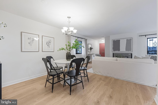 3460 Summit Ct NE Unit 3460, Washington, DC 20018 - dining space with light wood finished floors and a chandelier