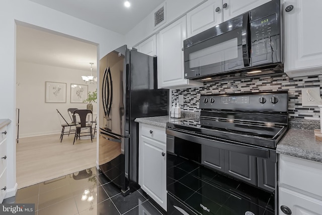 3460 Summit Ct NE Unit 3460, Washington, DC 20018 - kitchen with black appliances, white cabinets, a chandelier, backsplash, and dark tile patterned floors