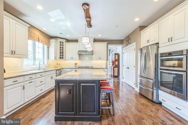 3132 Butternut Ln, Chester Springs, PA 19425 - kitchen featuring stainless steel appliances, dark wood-type flooring, white cabinetry, and recessed lighting