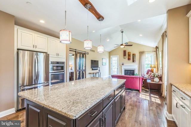 3132 Butternut Ln, Chester Springs, PA 19425 - kitchen featuring stainless steel appliances, a barn door, white cabinets, hardwood / wood-style flooring, and a ceiling fan