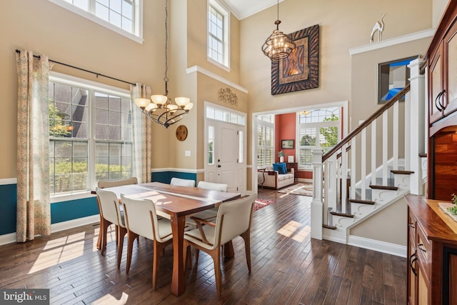 3132 Butternut Ln, Chester Springs, PA 19425 - dining space featuring a chandelier, healthy amount of natural light, dark wood-type flooring, a high ceiling, and ornamental molding