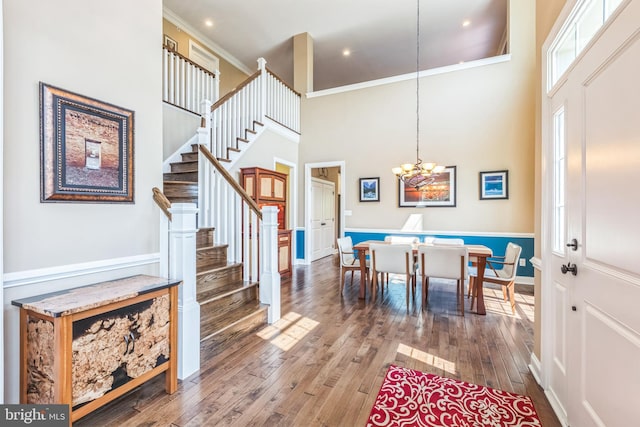 3132 Butternut Ln, Chester Springs, PA 19425 - entrance foyer with stairs, a high ceiling, wood-type flooring, crown molding, and a chandelier