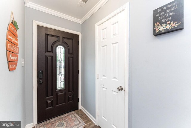 2129 Fort Donelson Ct, Dumfries, VA 22026 - foyer entrance featuring dark wood-style floors and crown molding