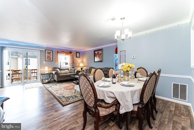 2129 Fort Donelson Ct, Dumfries, VA 22026 - dining space featuring a chandelier, wood finished floors, and ornamental molding