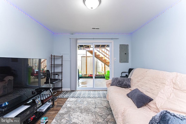 2129 Fort Donelson Ct, Dumfries, VA 22026 - living area featuring electric panel and wood finished floors