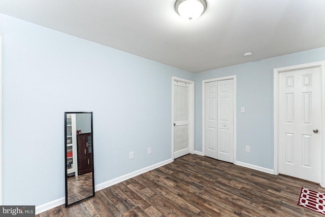 2129 Fort Donelson Ct, Dumfries, VA 22026 - unfurnished bedroom featuring dark wood finished floors and a closet