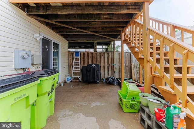 2129 Fort Donelson Ct, Dumfries, VA 22026 - view of patio / terrace with a carport, stairway, a grill, and an exterior structure