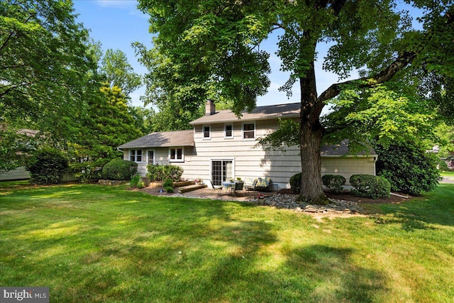 1904 Woodland Dr, Yardley, PA 19067 - back of house with a patio, a yard, and a chimney