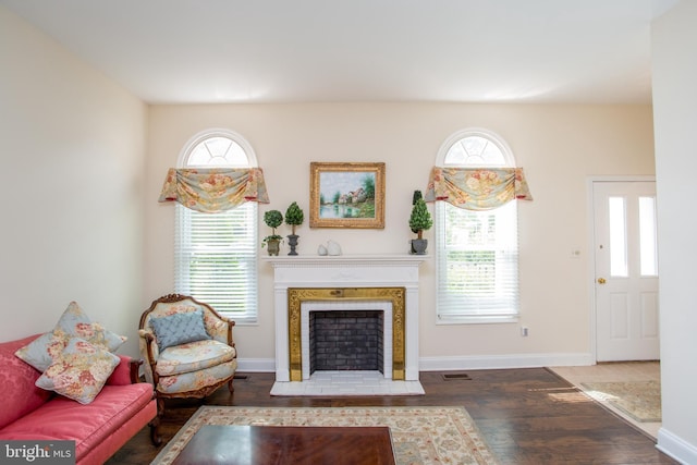 114 Pipers Pl, Chalfont, PA 18914 - living area featuring wood finished floors, plenty of natural light, and a tiled fireplace