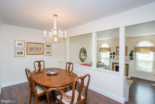 114 Pipers Pl, Chalfont, PA 18914 - dining space with a chandelier, crown molding, dark wood-style floors, and a fireplace