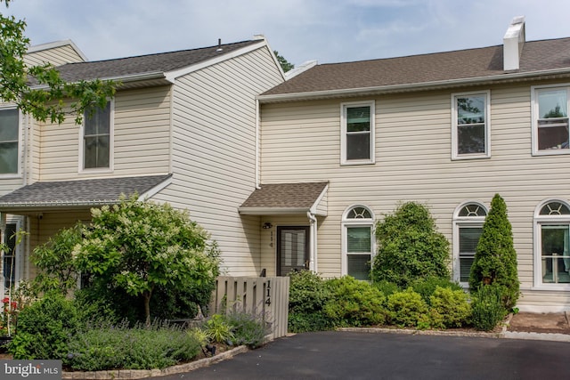 114 Pipers Pl, Chalfont, PA 18914 - view of front facade featuring roof with shingles and a chimney