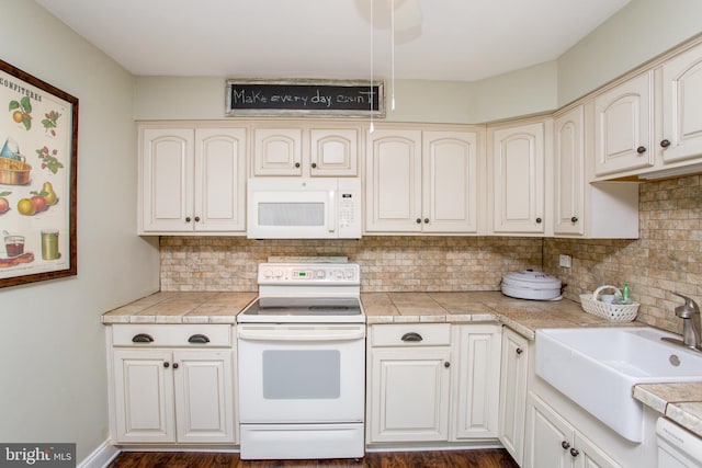 114 Pipers Pl, Chalfont, PA 18914 - kitchen featuring white appliances, backsplash, cream cabinetry, and dark wood-style floors