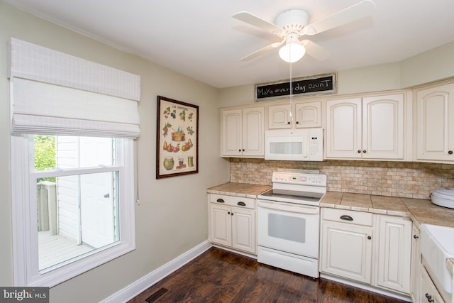 114 Pipers Pl, Chalfont, PA 18914 - kitchen featuring white appliances, tasteful backsplash, dark wood-style floors, tile counters, and a ceiling fan