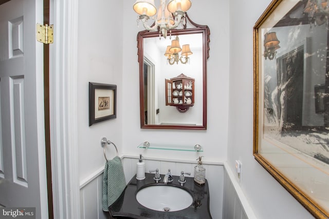 114 Pipers Pl, Chalfont, PA 18914 - bathroom featuring a chandelier, vanity, and wainscoting