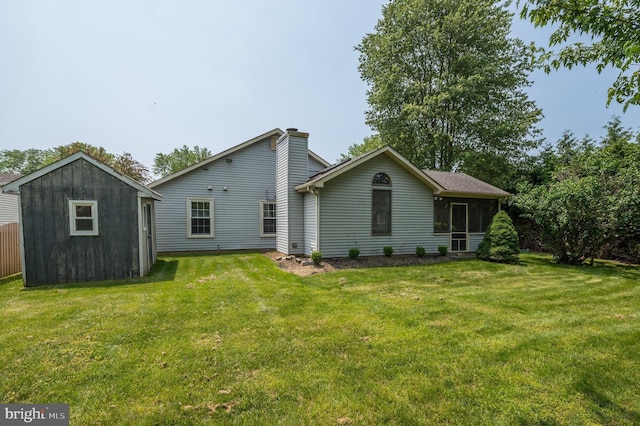 12 Mayville Ln, Marlton, NJ 08053 - back of house with a yard, a chimney, and a storage unit