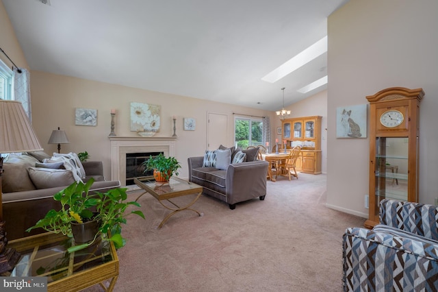 12 Mayville Ln, Marlton, NJ 08053 - living area featuring vaulted ceiling, a chandelier, a skylight, carpet flooring, and a glass covered fireplace