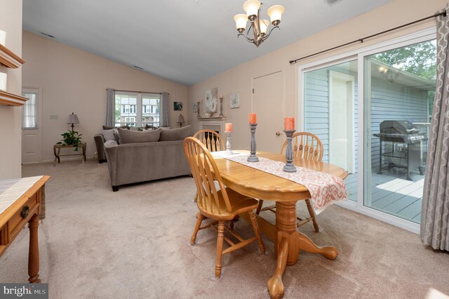 12 Mayville Ln, Marlton, NJ 08053 - dining space featuring vaulted ceiling, light colored carpet, and a chandelier