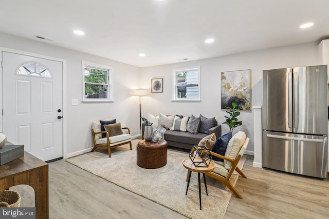 919 Mentor Ave, Capitol Heights, MD 20743 - living room with plenty of natural light, light wood-style flooring, and recessed lighting