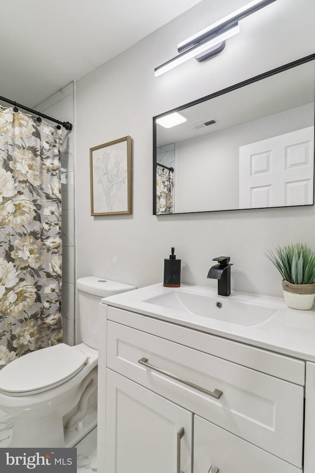 919 Mentor Ave, Capitol Heights, MD 20743 - bathroom featuring vanity, marble look tiles, and a shower with shower curtain