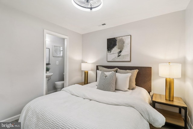 919 Mentor Ave, Capitol Heights, MD 20743 - bedroom with baseboards and connected bathroom