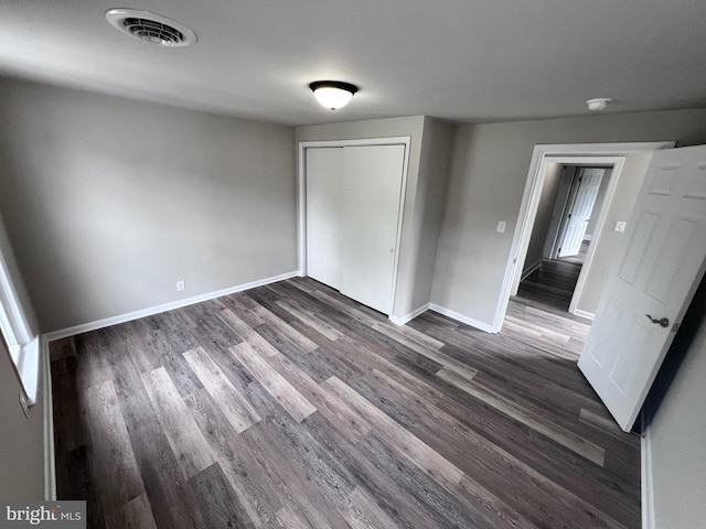 122 W N St, Waynesboro, PA 17268 - unfurnished bedroom featuring dark wood-type flooring and a closet