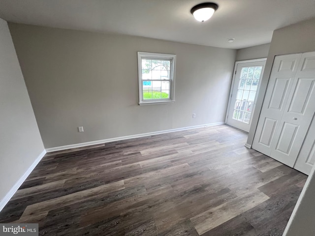 122 W N St, Waynesboro, PA 17268 - unfurnished bedroom with multiple windows, wood finished floors, and a closet