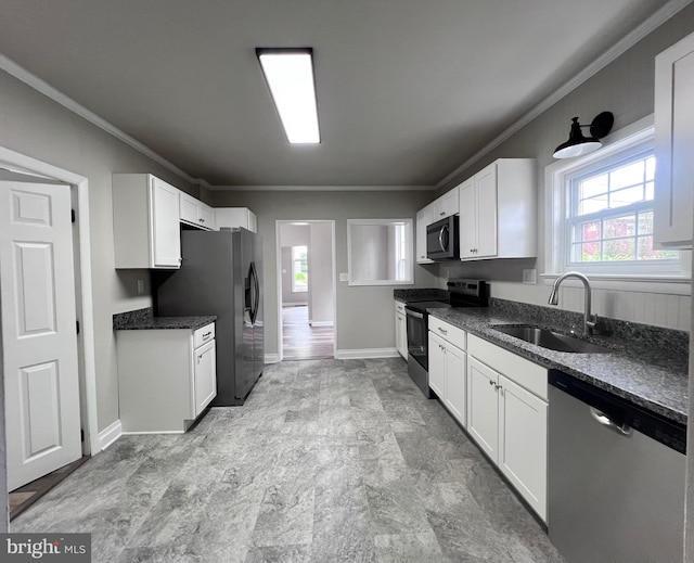122 W N St, Waynesboro, PA 17268 - kitchen with appliances with stainless steel finishes, ornamental molding, and white cabinets