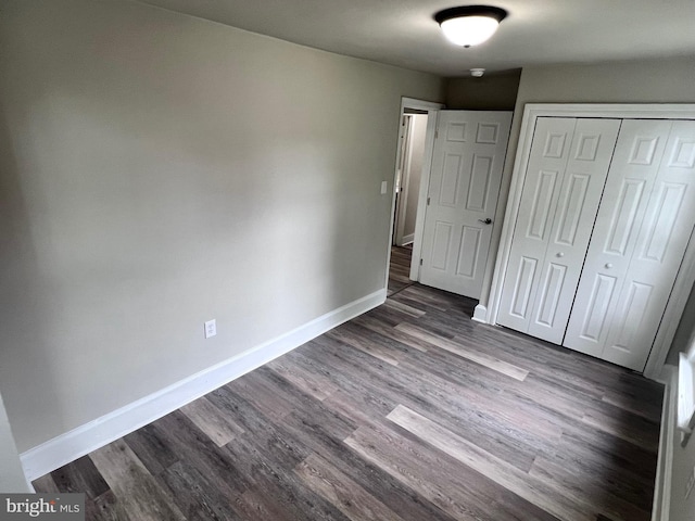 122 W N St, Waynesboro, PA 17268 - unfurnished bedroom featuring dark wood-style flooring and a closet