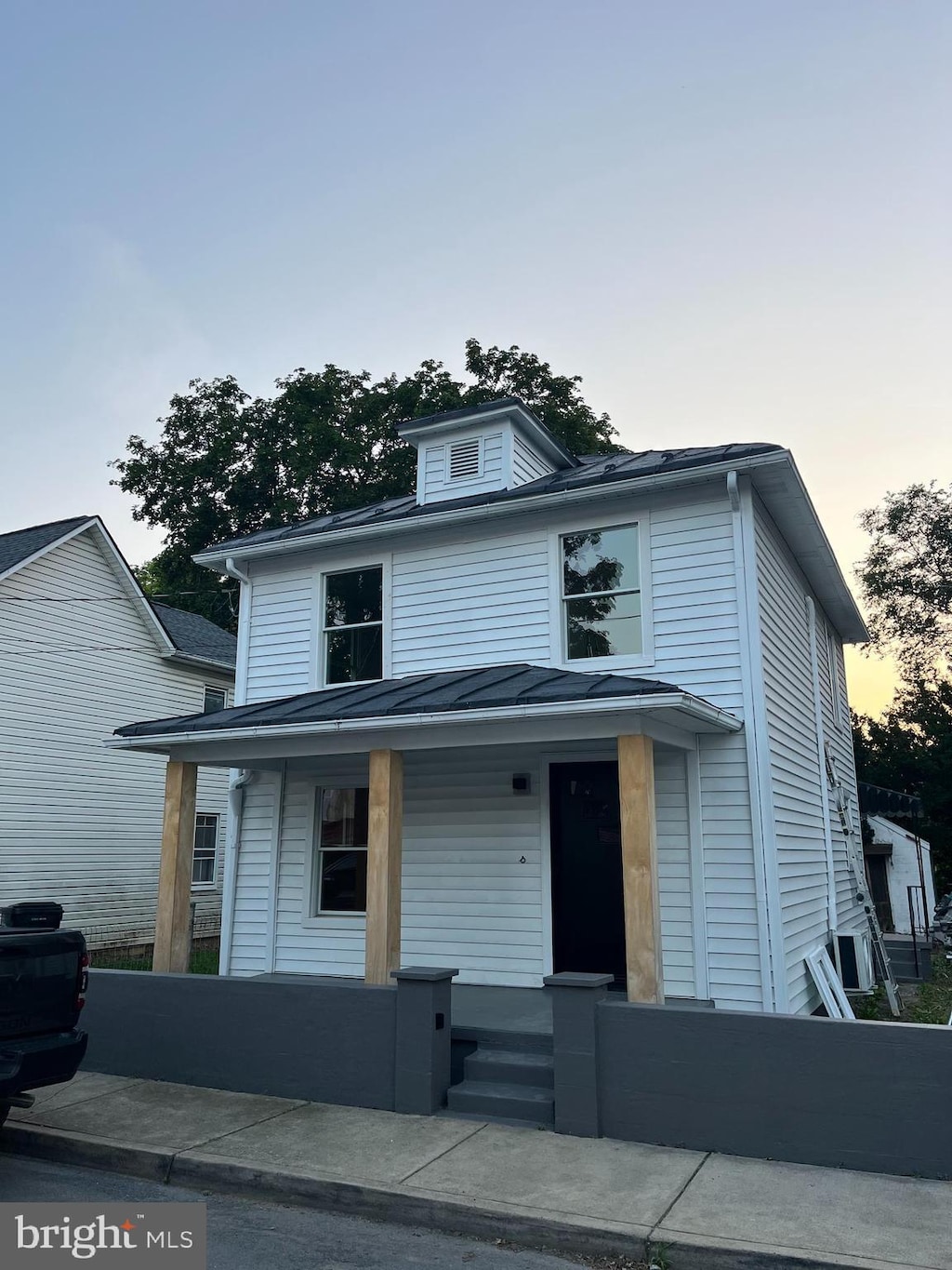 553 Highland Ave, Winchester, VA 22601 - american foursquare style home with a porch, a standing seam roof, and a metal roof