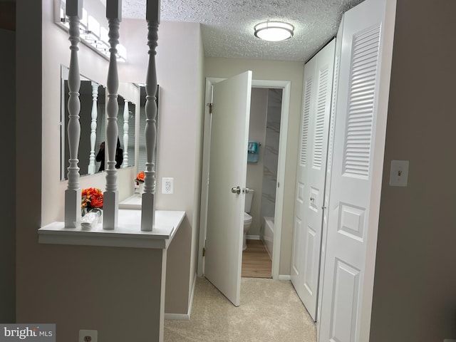 9220 Redbridge Ct, Laurel, MD 20723 - corridor featuring light carpet and a textured ceiling